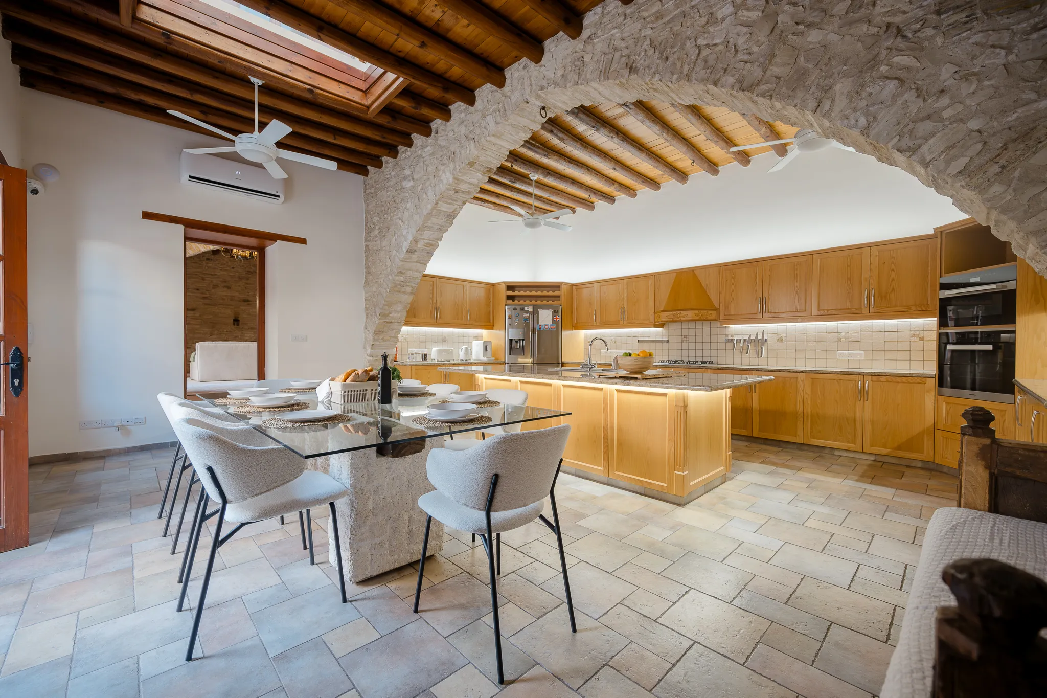 The kitchen and dining table through the arch