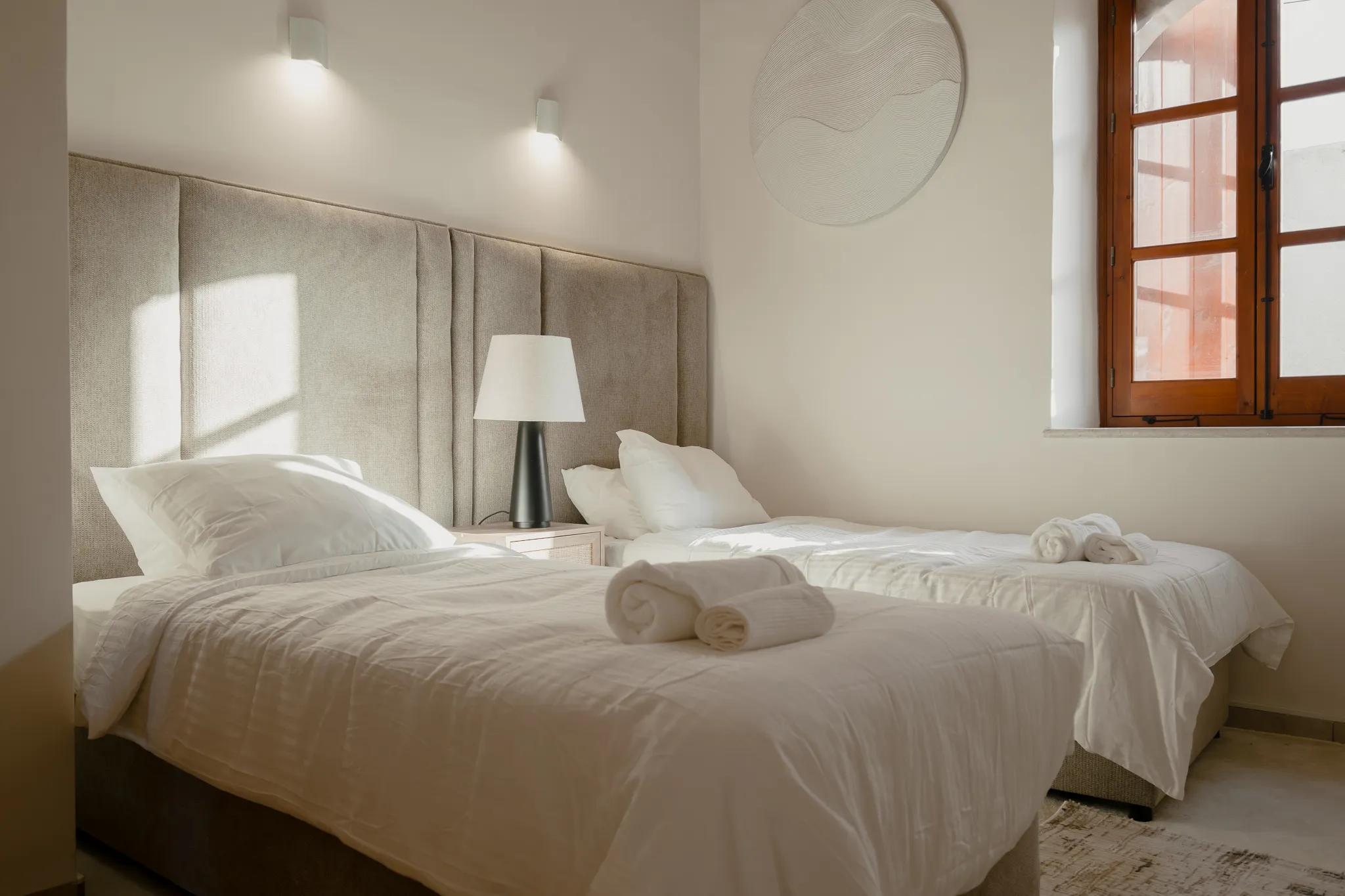 A twin bedroom in the morning light