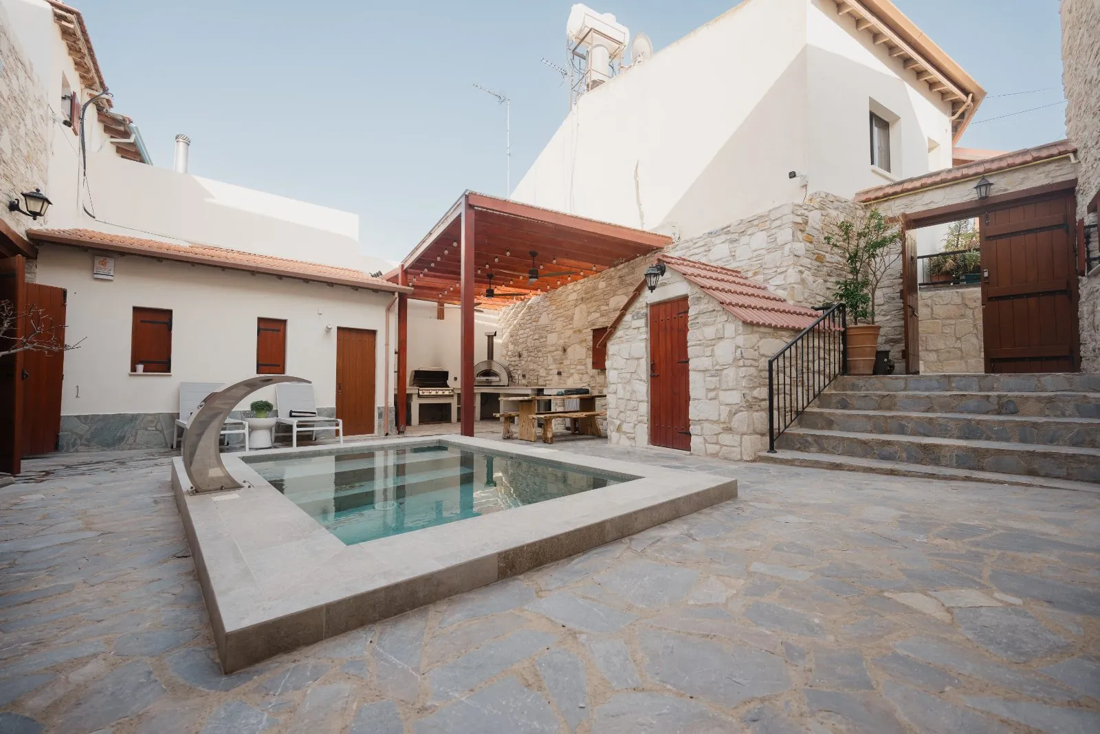 The Bakery's stone courtyard, plunge pool and outdoor kitchen