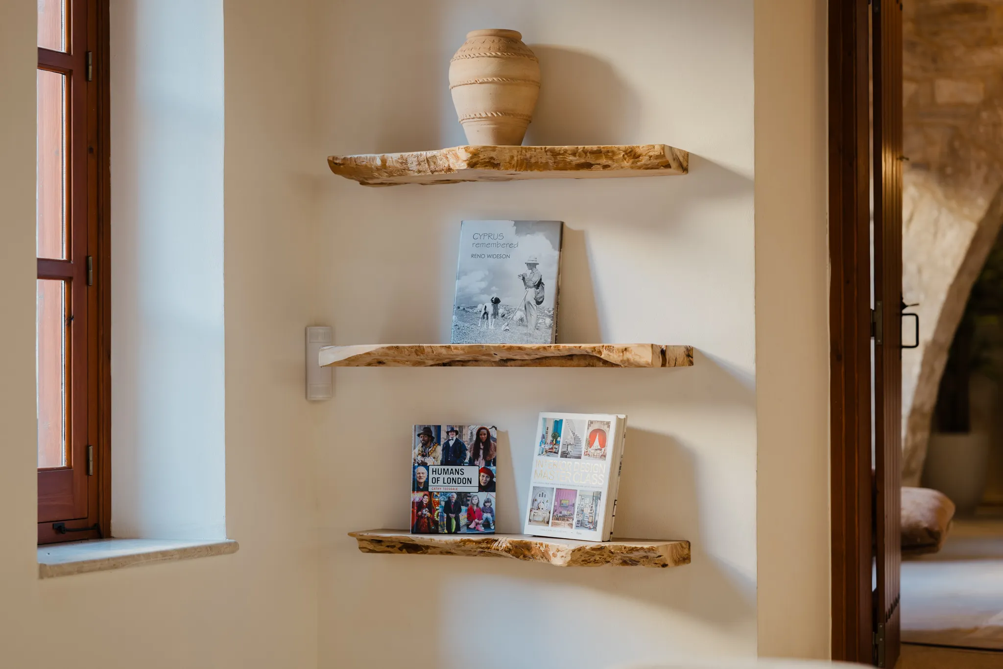 Olive-wood shelves and books