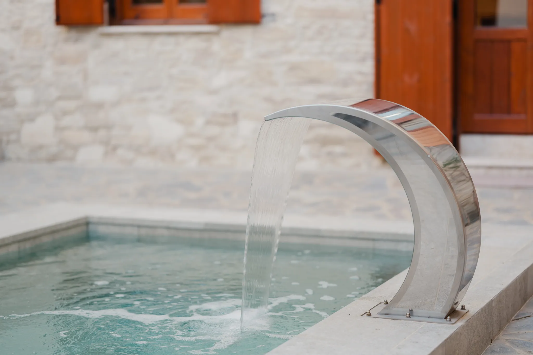 The fountain pouring into the plunge pool