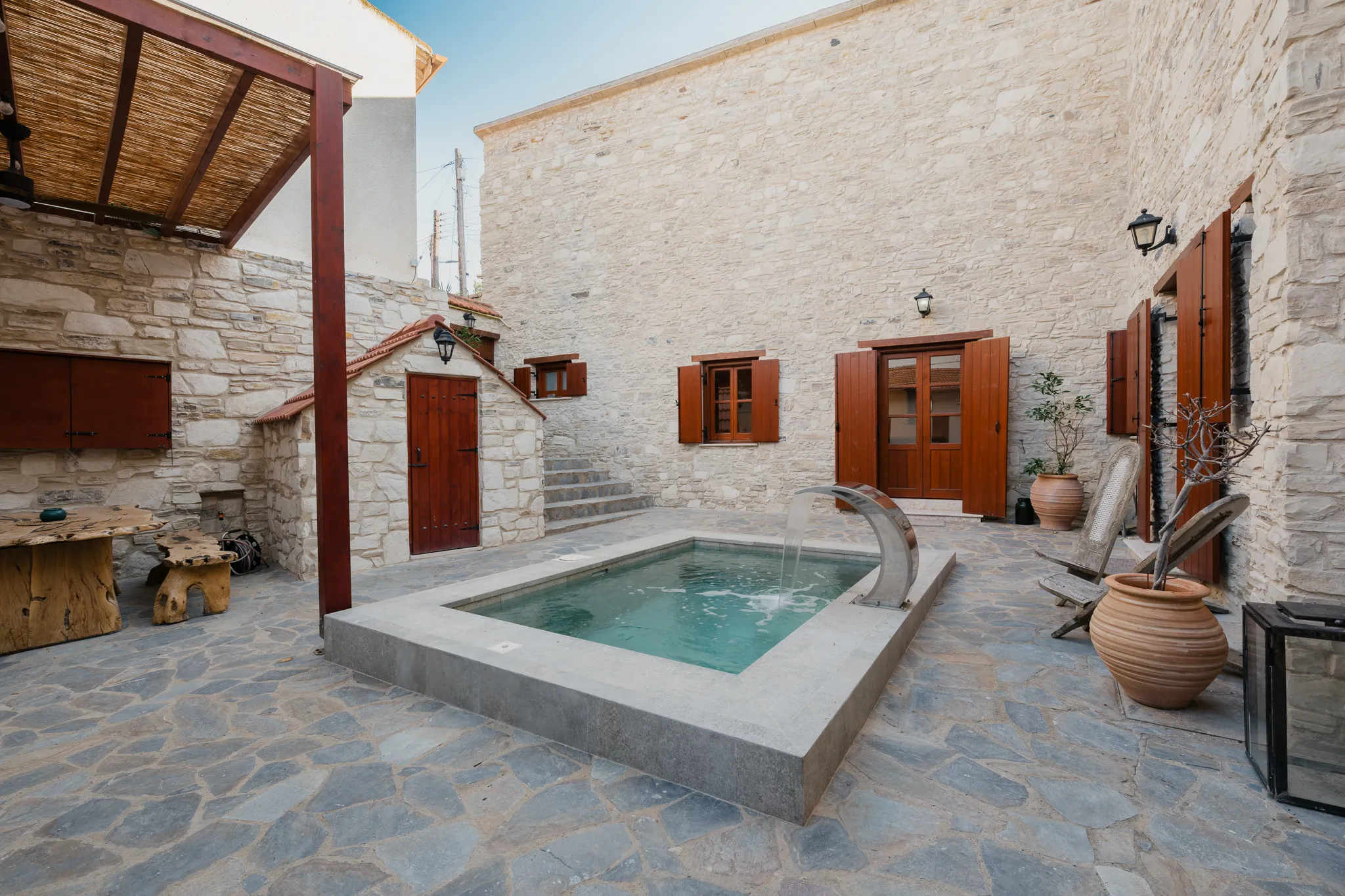 The courtyard, plunge pool and pergola
