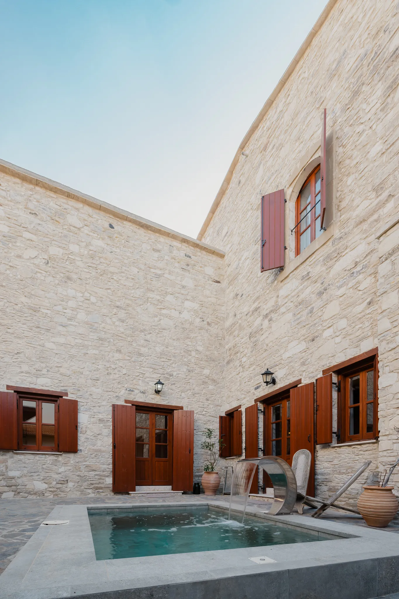 The plunge pool beneath the stone walls