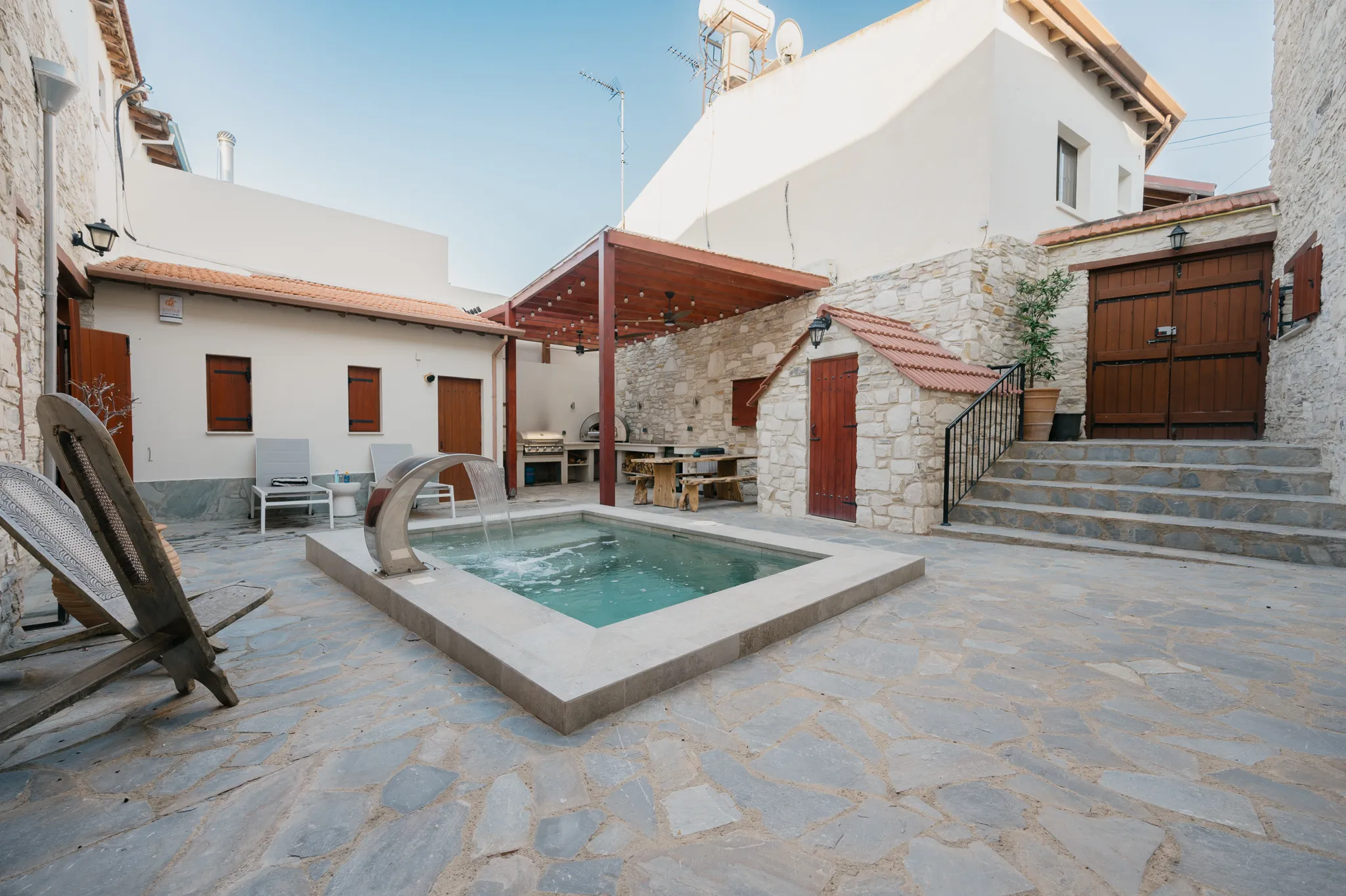 The courtyard, pool and outdoor kitchen