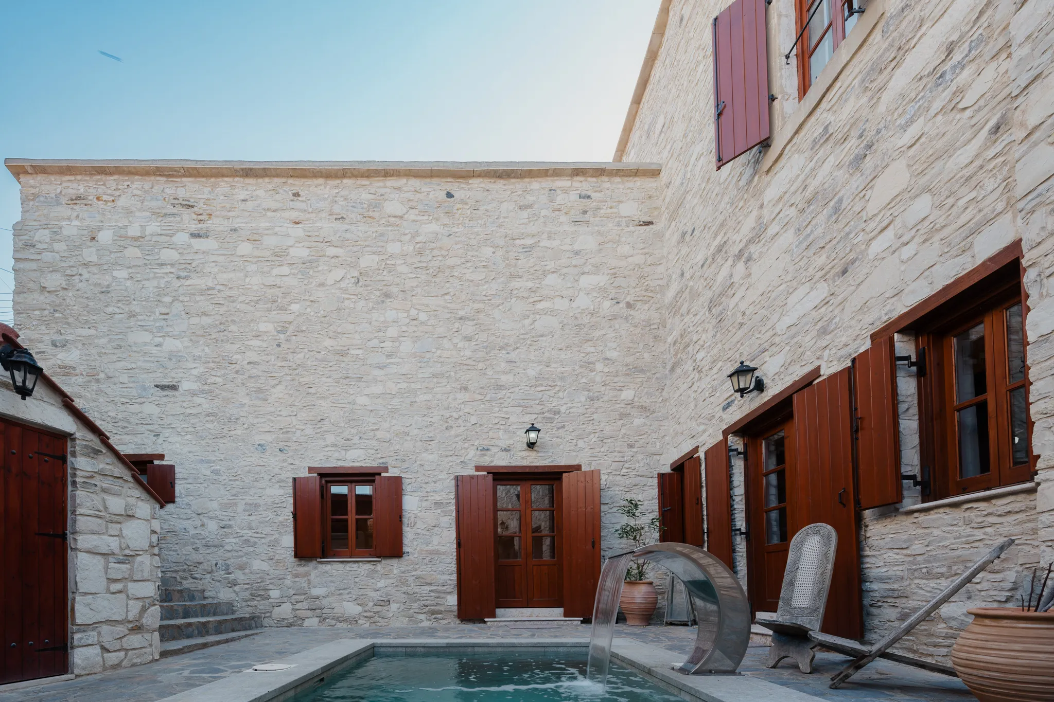 Stone walls above the pool