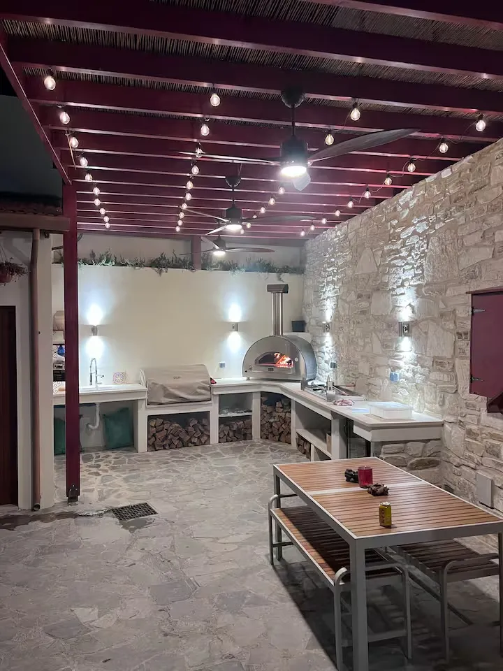 The covered outdoor dining area at night
