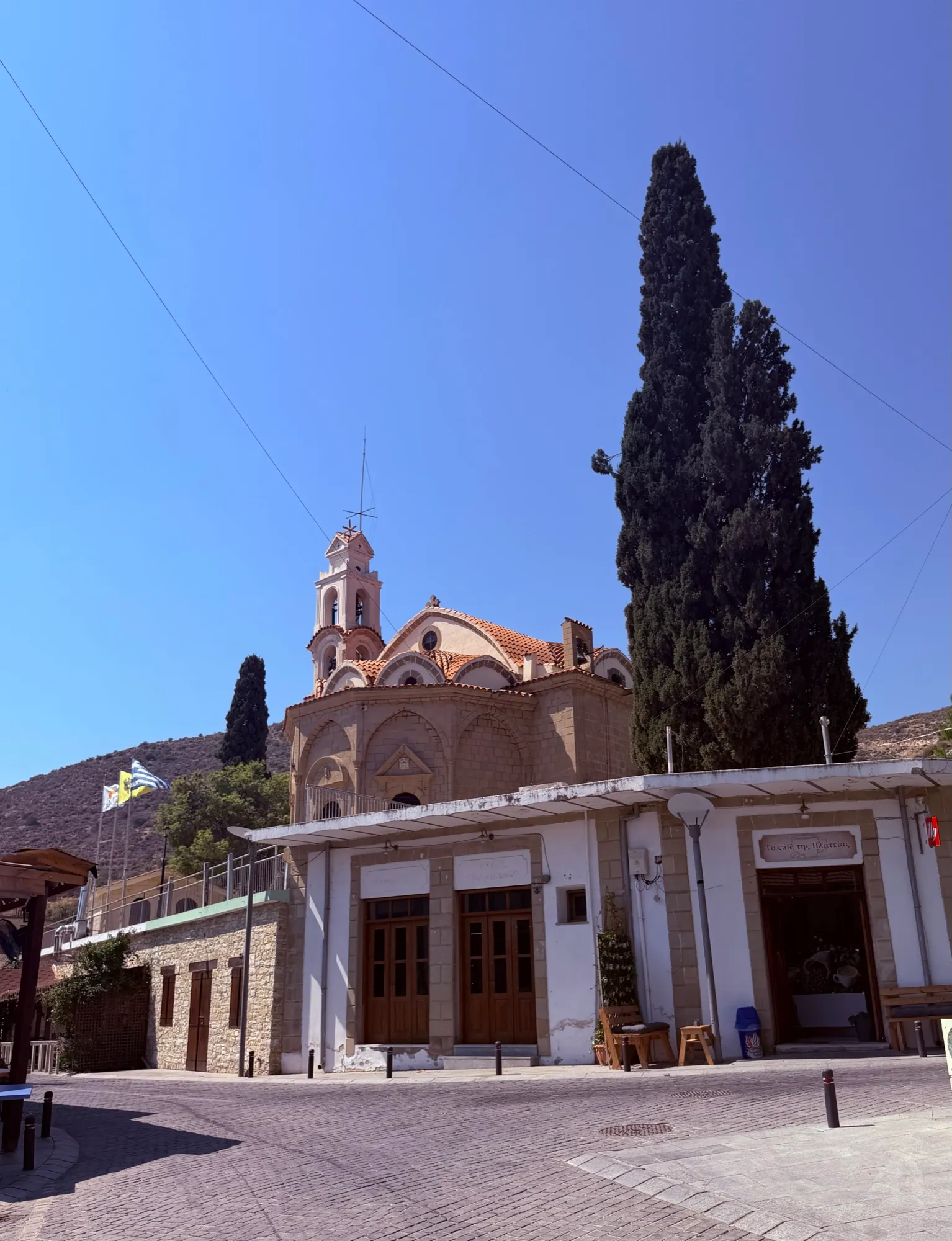 The domed village church and cypress tree