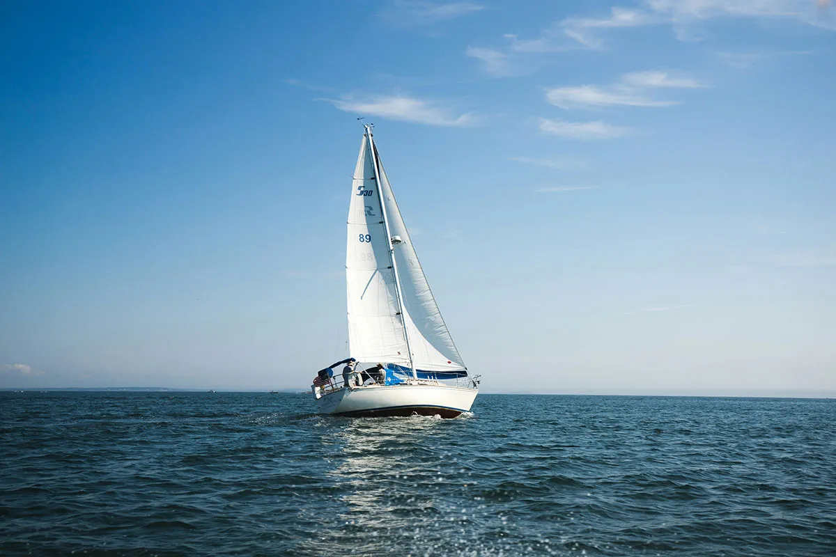 A yacht under sail off the coast